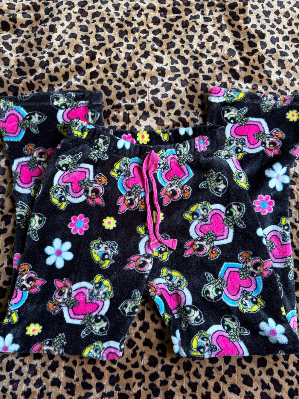 The Powerpuff Girls with pink hearts and white and blue flowers